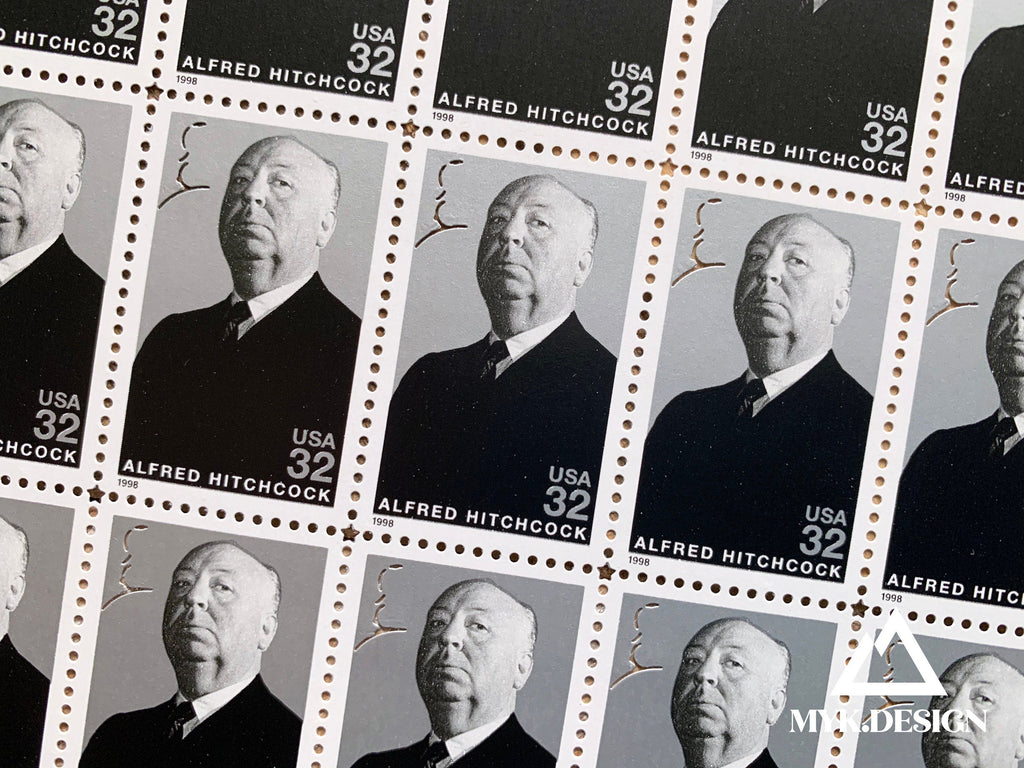 Close-up of the 1998 Alfred Hitchcock U.S. postage stamp (Scott 3226), 32 cents, Legends of Hollywood series, featuring a grayscale portrait and Hitchcock’s silhouette profile.