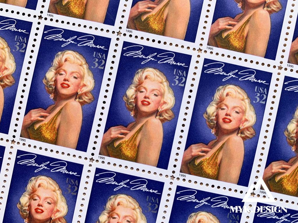 Close-up of 1995 Marilyn Monroe Legends of Hollywood 32¢ U.S. postage stamps featuring Marilyn in a gold dress against a blue background.