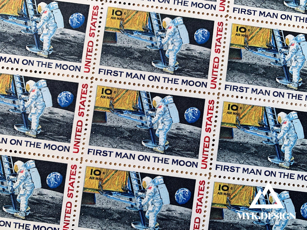 Sheet of 1969 “First Man on the Moon” U.S. postage stamps, 10¢ airmail, Scott C76, featuring an astronaut stepping onto the lunar surface with Earth in the background.
