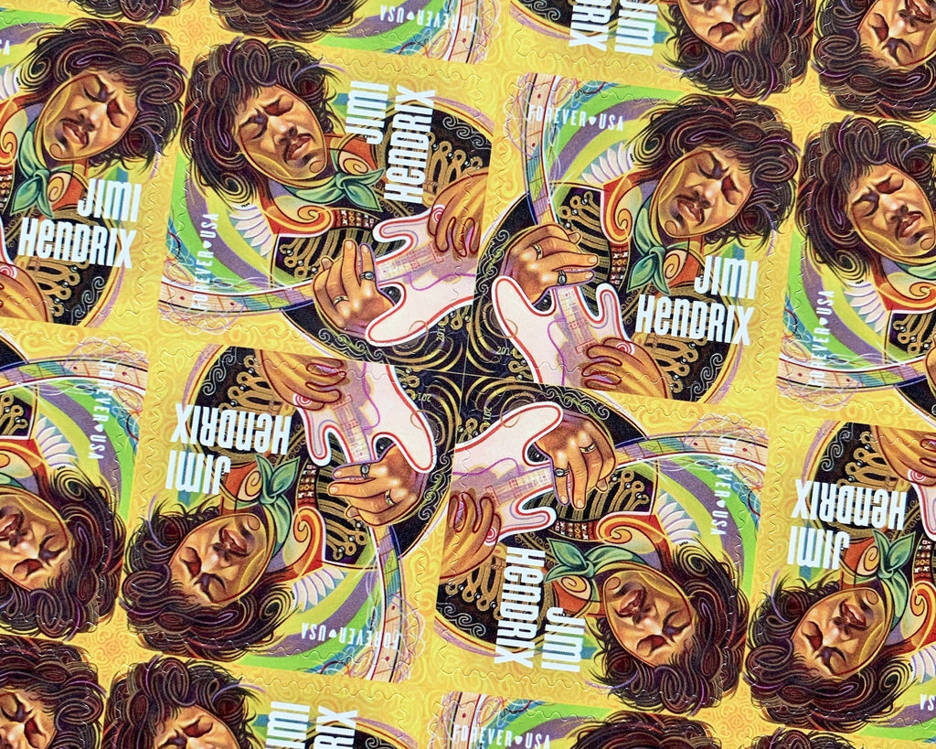 Close-up photo of Jimi Hendrix U.S. postage stamps, 2014 Music Icons series, Forever 1 oz rate, Scott 4880, featuring a psychedelic portrait of Hendrix playing guitar.