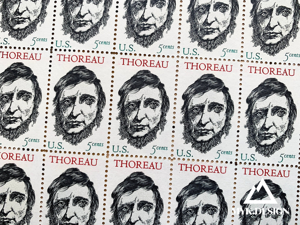 Close-up of the 1967 Henry David Thoreau U.S. postage stamp (Scott 1327), 5 cents, featuring Thoreau’s portrait with Walden Pond in the background.
