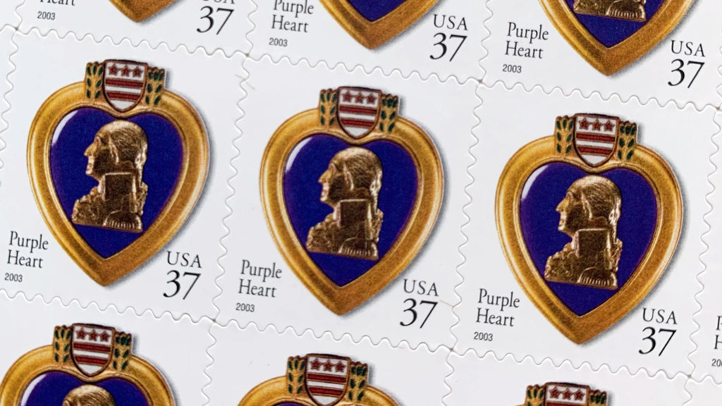 Close-up of the 2003 Purple Heart U.S. postage stamp (Scott 3784), 37 cents, showing a full-color image of the Purple Heart medal featuring George Washington’s profile.