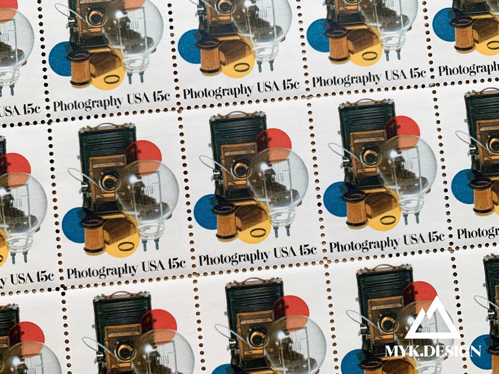 Close-up of the 1978 U.S. Photography stamp, Scott 1758, 15 cents, featuring a vintage camera, oversized light bulb, and colorful CMYK-style design elements representing the art and craft of photography.